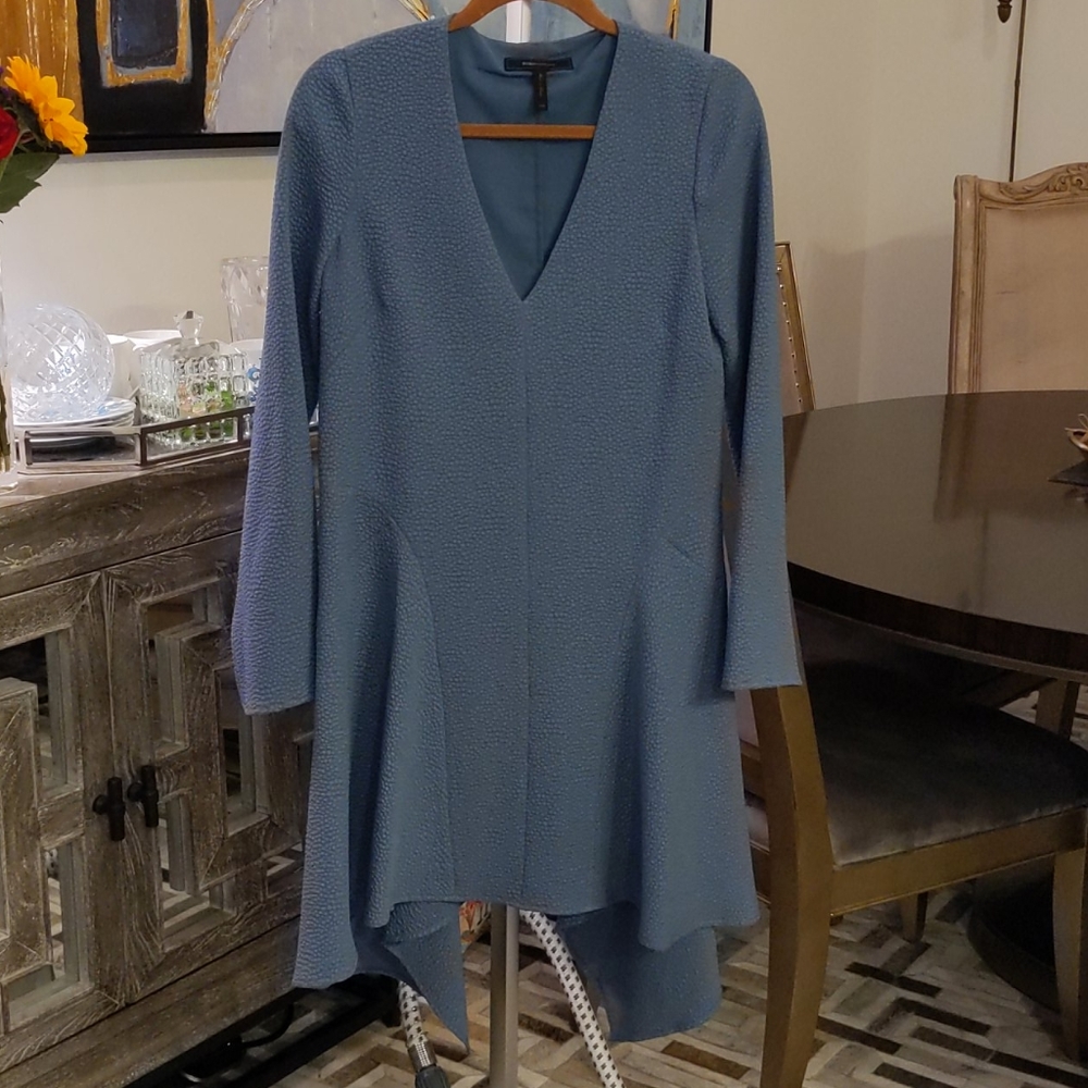 Medium blue dress with flared bottom.